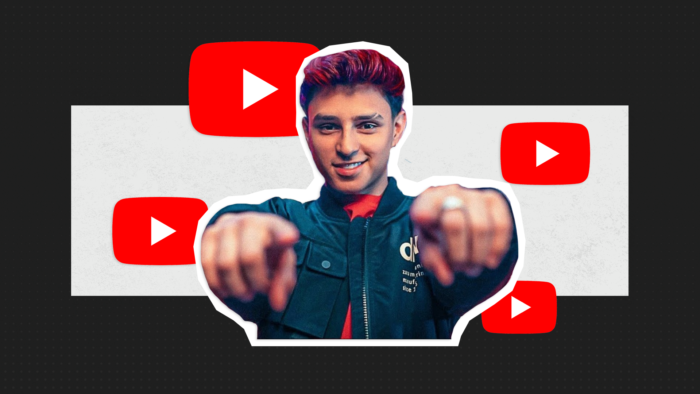 Brazilian Gamer Nobru Pointing Fingers At The Camera, With A Youtube Logo Themed Background