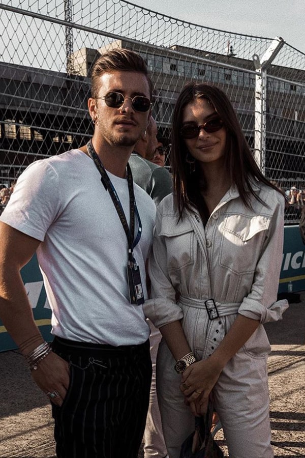 Formula E influencer image of a man and woman at a Formula E track event