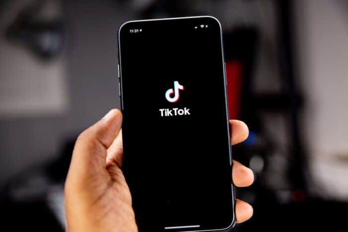 Mobile Phone In Hand Showing Tiktok
