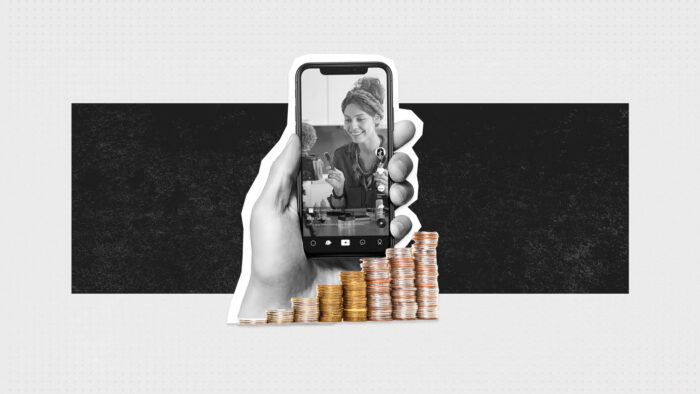 Grahic Representing Social Commerce With A Hand Holding A Phone Next To A Pile Of Coins